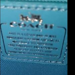 Authentic coach crossbody/wrist clutch